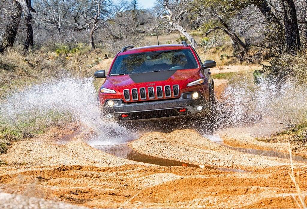 4x4 crossing water on an off-road track